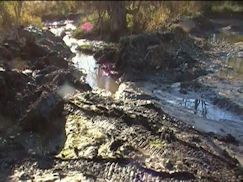 first backhoe operation digging out dam