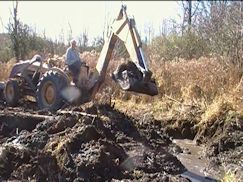 Backhoe 3rd shot at secondary dam