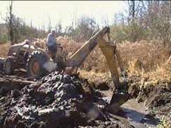 backhoe 4th shot at secondary beaver dam