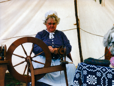 Sheri Spinning in her Tent at Pepin
